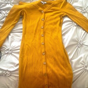 A yellow mustard fitted long sleeve dress